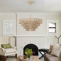 20" woven hemp rope 4-layer chandelier hanging in a bright living room with fireplace, boho pendant light fixture