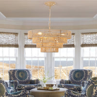 Modern woven hemp rope tiered chandelier hanging above a seating area near bay windows, elegant boho pendant light