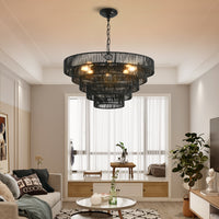 24" black woven hemp rope 5-tier chandelier hanging above a living room seating area, boho pendant light fixture
