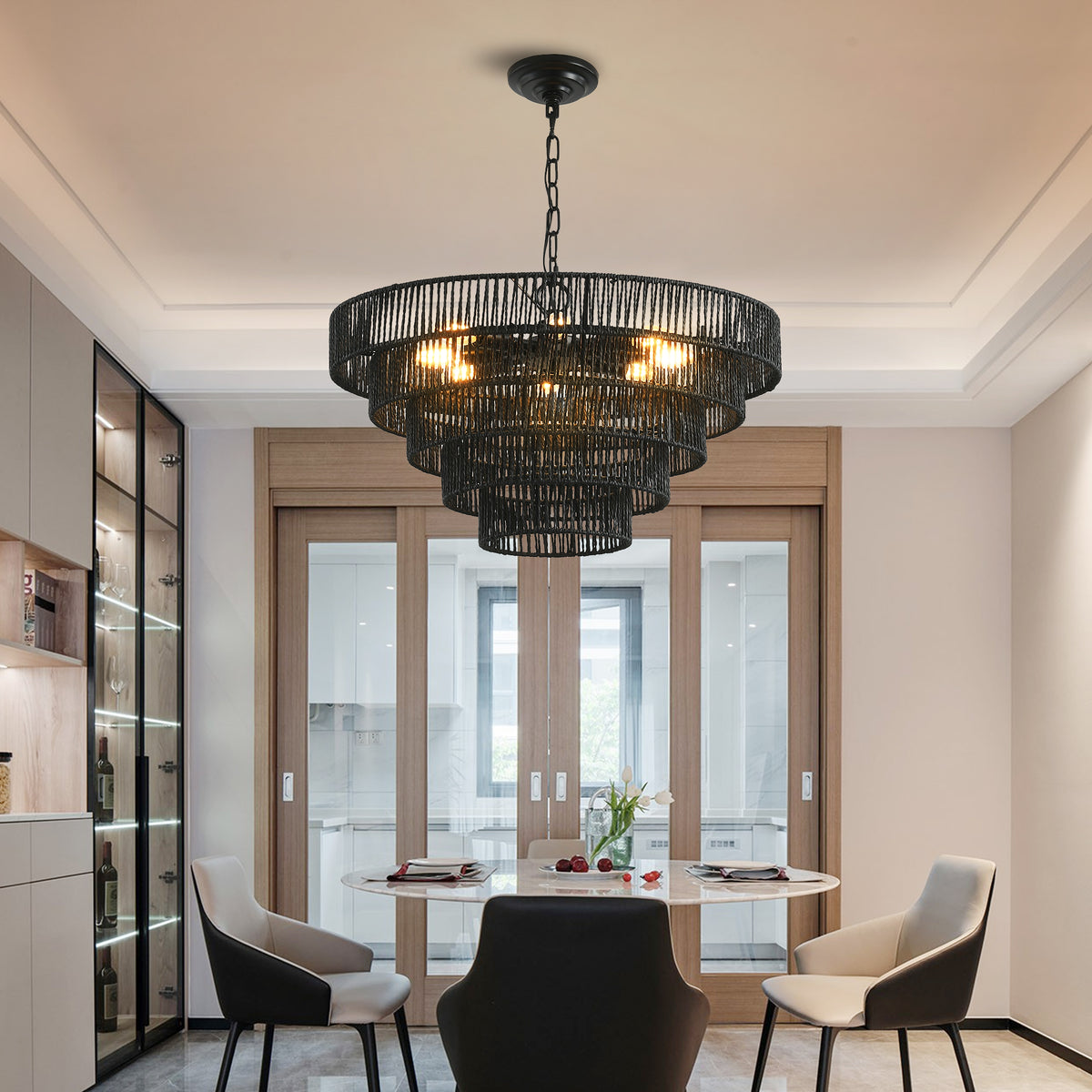 24" natural woven hemp rope 5-tier chandelier hanging above a dining table with black chairs, boho pendant light