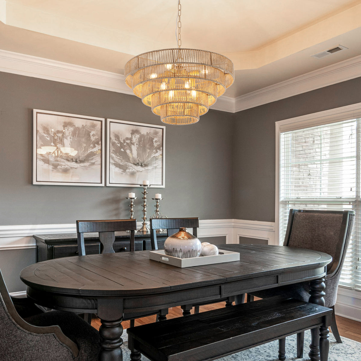Woven hemp rope 5-layer chandelier hanging above a black dining table set, elegant boho hanging light fixture